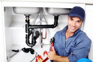 VIGILANT-plumber-fixing-a-sink-shutterstock_132523334-e1448389230378.jpg  