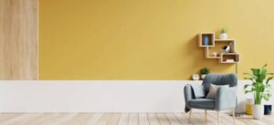 living-room-interior-with-fabric-armchair-lamp-book-plants-empty-yellow-wall-background-wall-painting-ideas.jpg  