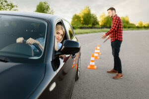 instructor-is-happy-with-driving-his-female-student-cones-lesson-driving-school-man-teaching-lady-driver-s-license-education.jpg  