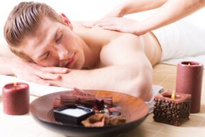 handsome-man-lying-spa-salon-enjoying-deep-tissue-back-massage.jpg  